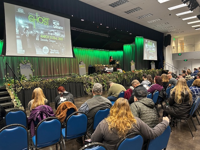 Oregon Ghost Conference main stage with lighting at the Seaside Civic and Convention Center